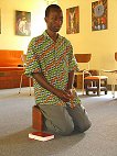 Praying in the chapel, Innocent Burundi